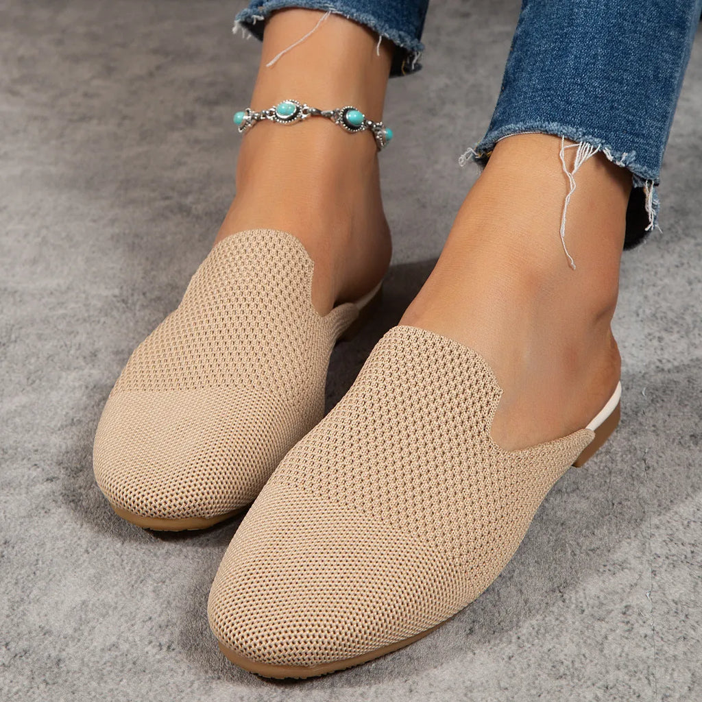 Women's apricot mesh slip-on sandals with round toe and flat rubber sole on a plain background.