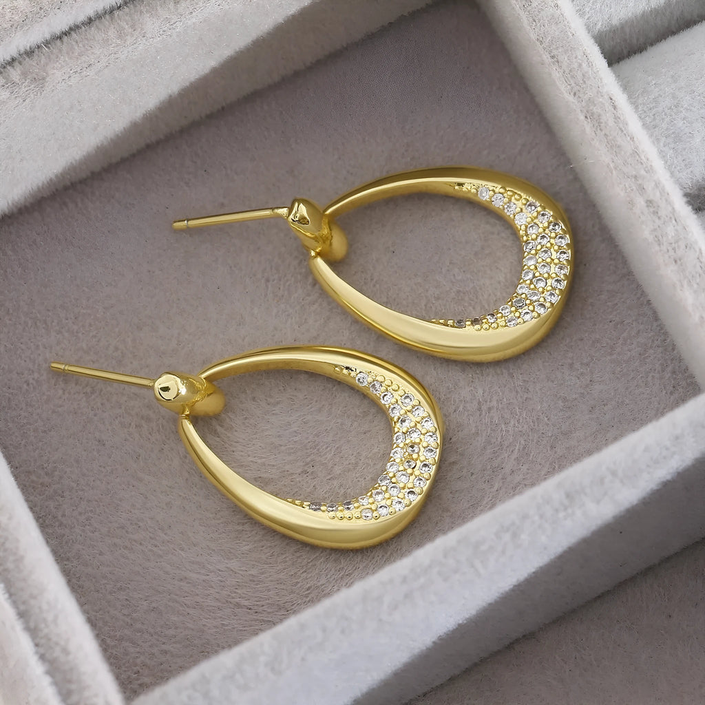 Geometric drop-shaped women's earrings in yellow gold colour with zircon design elements