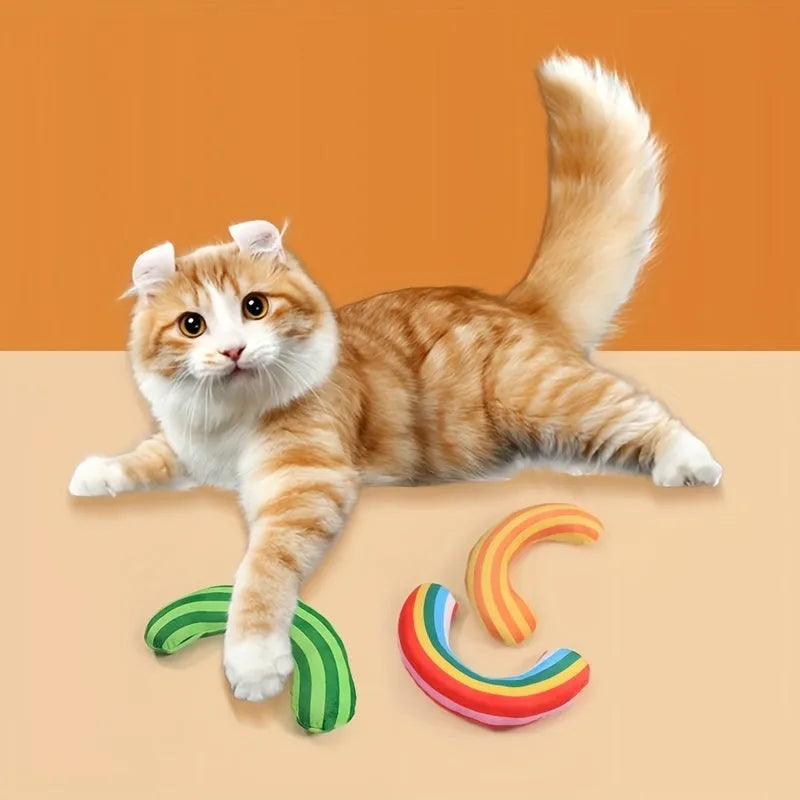 Striped green cat toy pillow with noise maker measuring 23cm alongside three additional cat toys