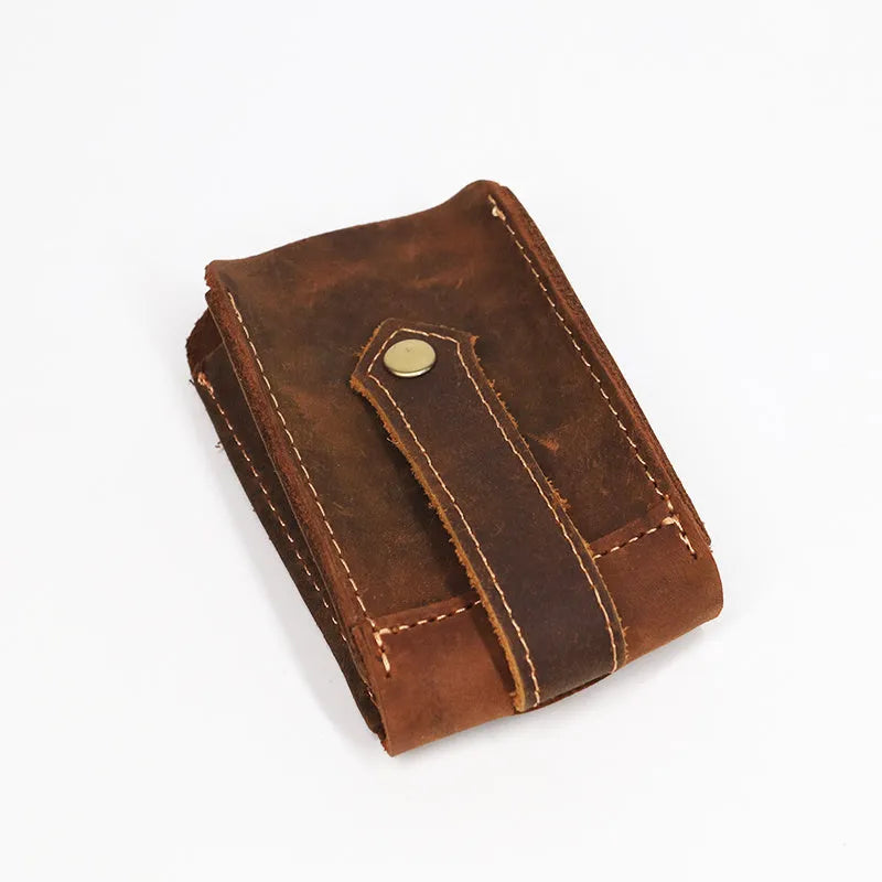 Crazy horse leather key case in dark brown, 7cm by 11.5cm, resting on a surface
