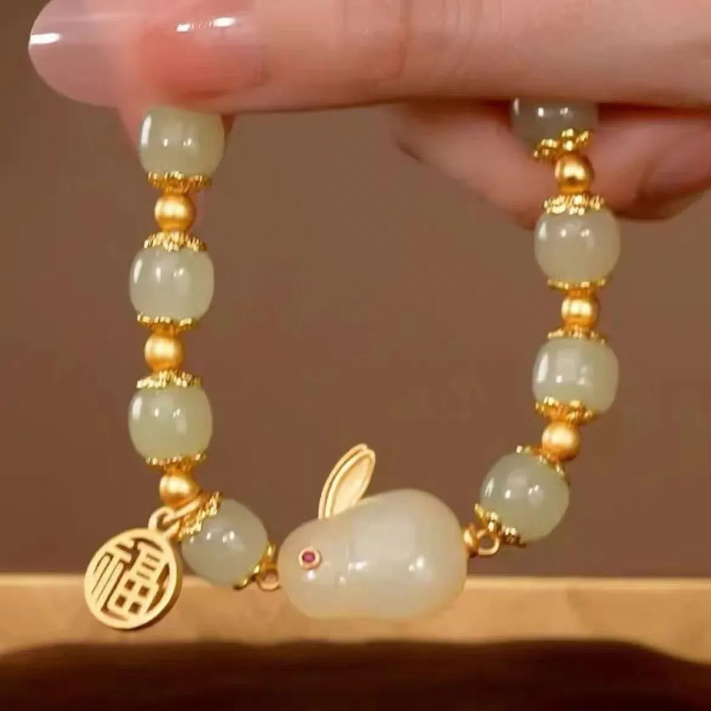 Women's green fu jade hare bracelet with black cord and lily motifs