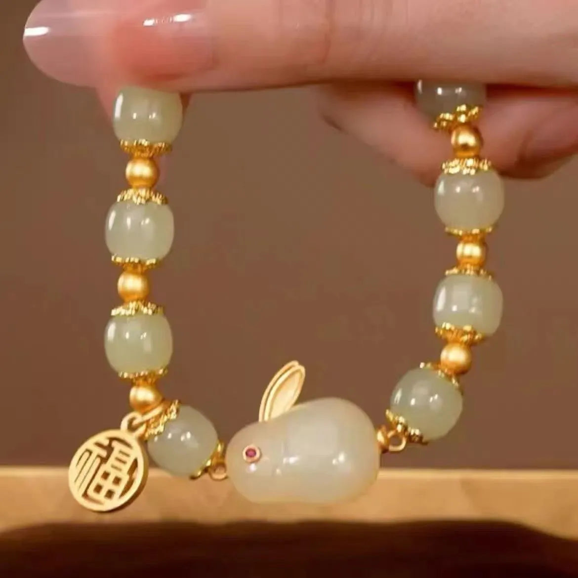 Women's green fu jade hare bracelet with black cord and lily motifs