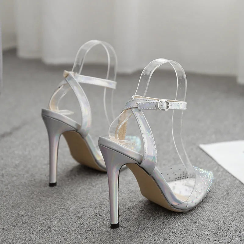 Women's pointed toe stiletto sandals with diamond embellishments on PVC upper, showing side view