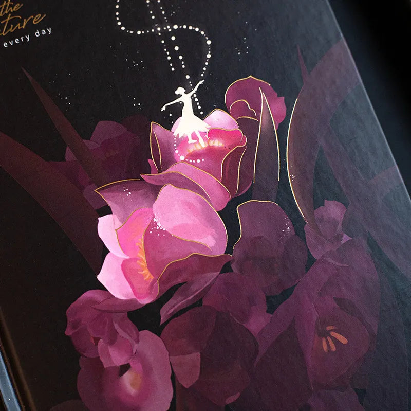 A5 notebook with luminous cover open to show internal colour illustrations, in Deep Blue, Gold, Light Blue, and Purple options