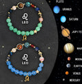 Pair of handmade natural stone beaded bracelets with zodiac sign designs on a textile background.