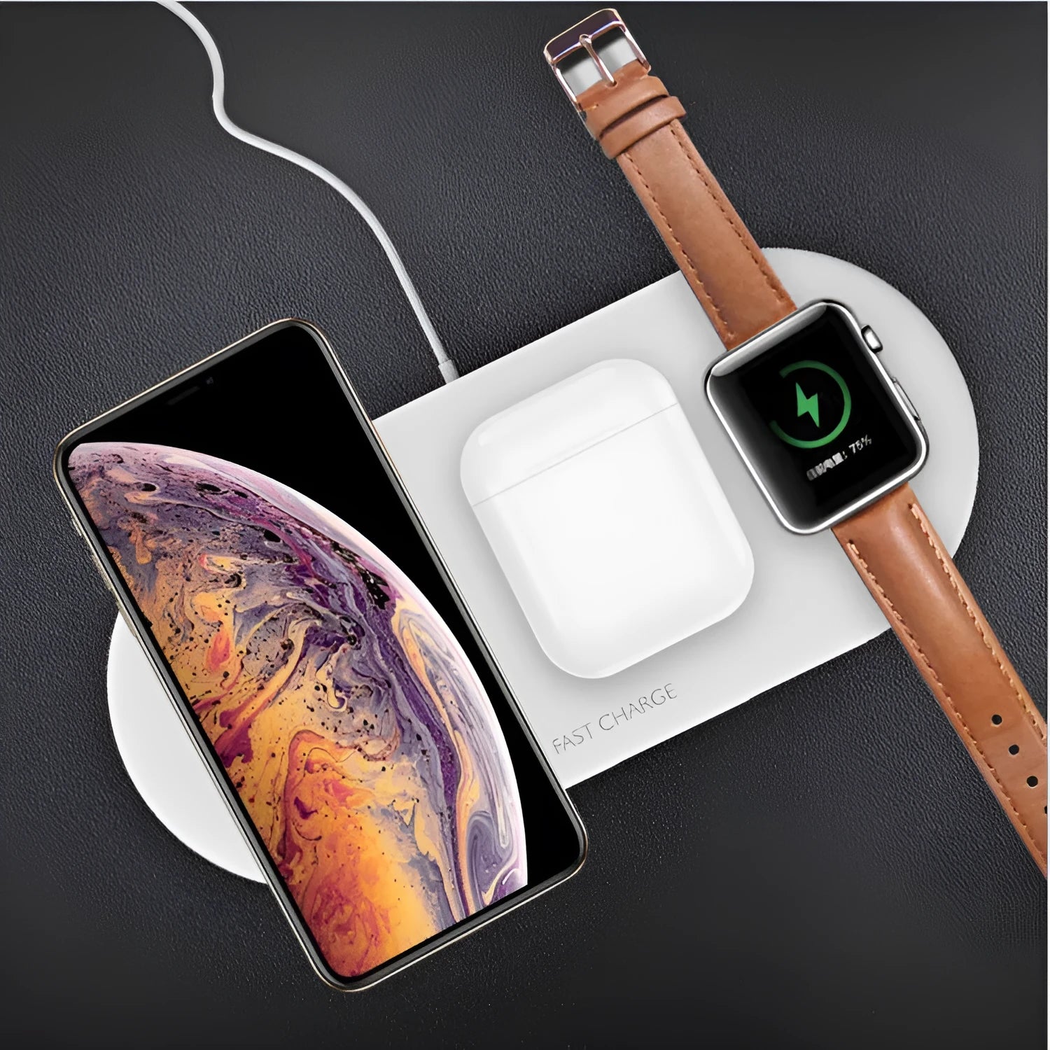 White three-in-one wireless charging station for Apple iPhone, iWatch and headphones on a desk.