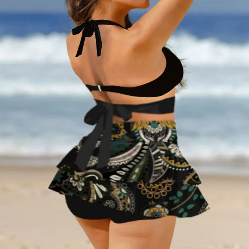 Purple women's high-waisted bikini set with matching skirt and lace-up detail