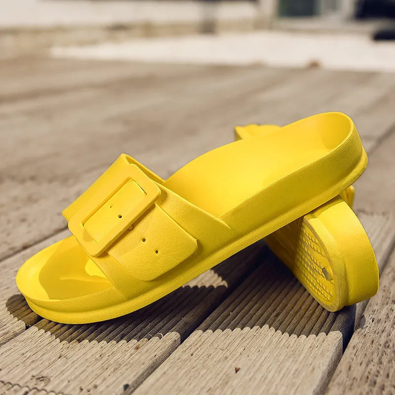 Women's grey blue flip-flop slippers with a buckle fastening on a white background