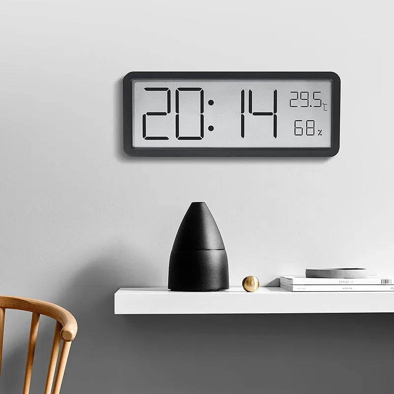 Simple large screen temperature and humidity clock with plastic shell in white Nordic style on a desk