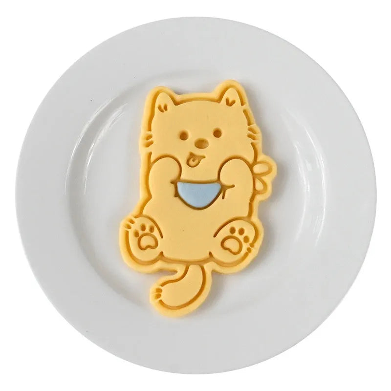 Three-dimensional plastic biscuit mould with dog-themed cartoon designs