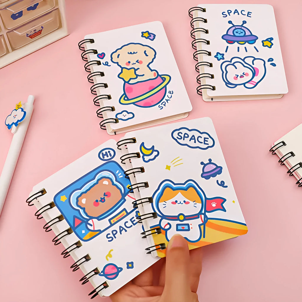 Astronaut-themed pocket flipper notebook showing compact 10.5 by 8 cm dimensions with space character cover options