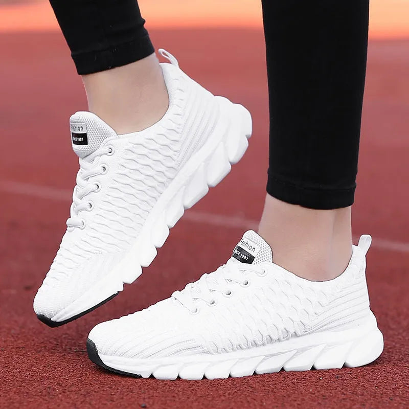 Women's running shoes with fly weaving upper in black, pink, or white colour options