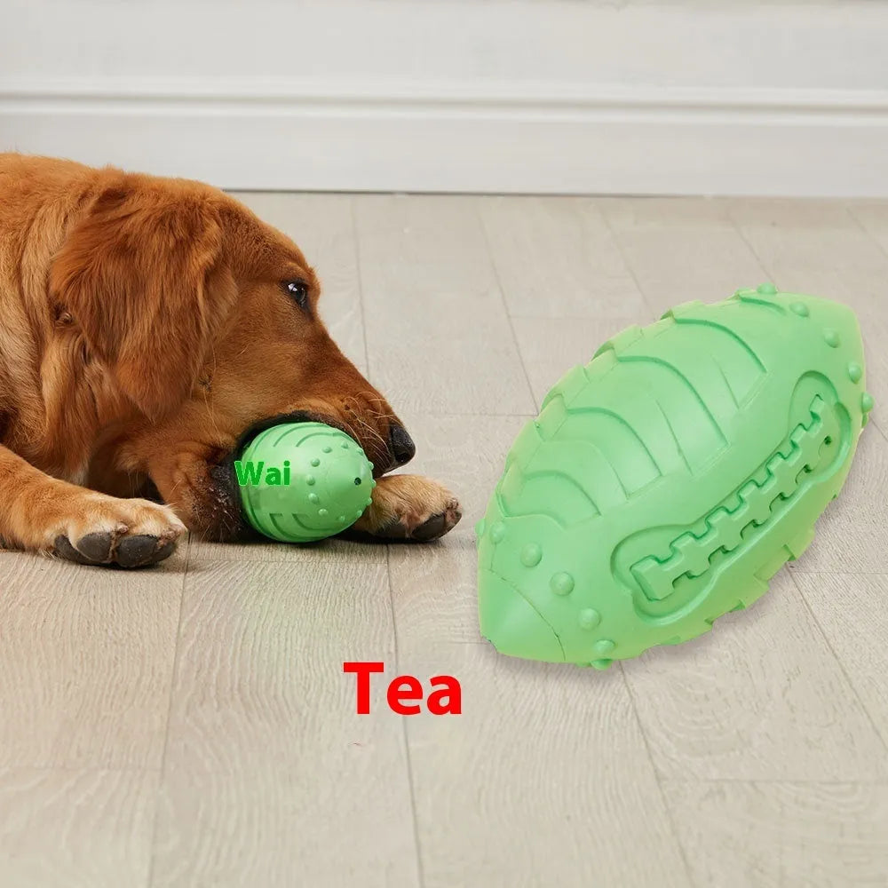 Light green rugby ball shaped dog chew toy with textured rubber surface for interactive play
