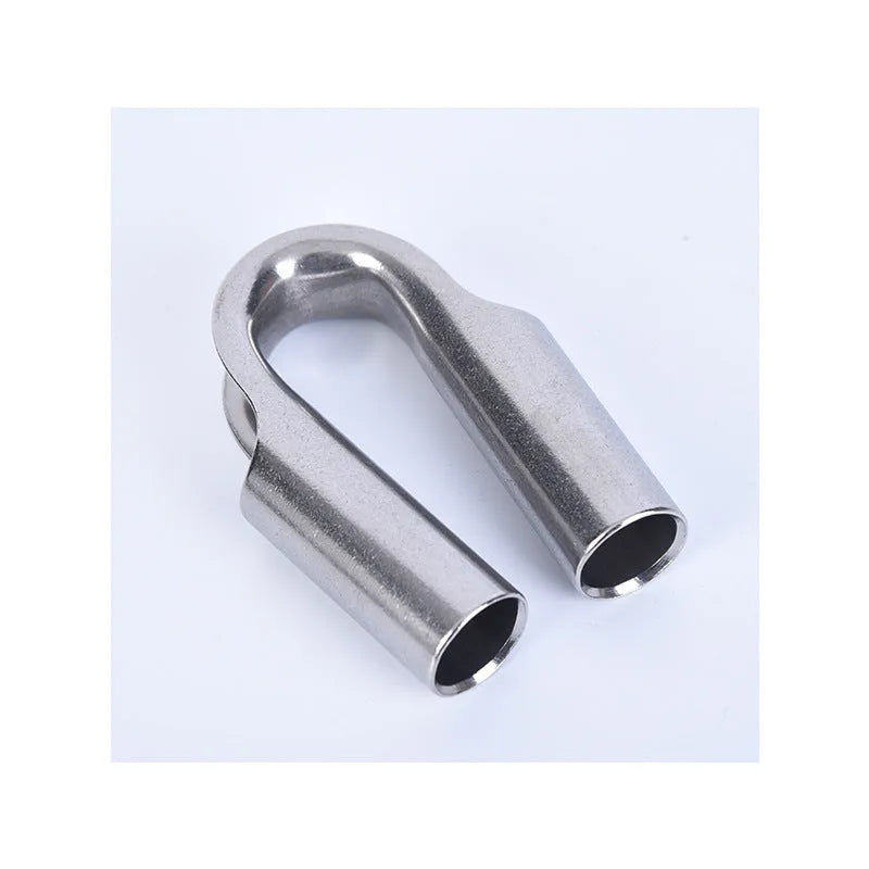 Stainless steel tubular chicken heart ring round sleeve ring set on a workshop surface