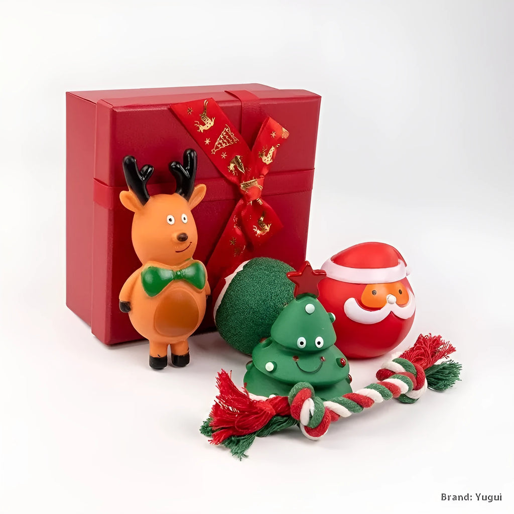 Set of vinyl Christmas-themed dog chew toys including balls, ropes, and Santa shapes in a gift bag.
