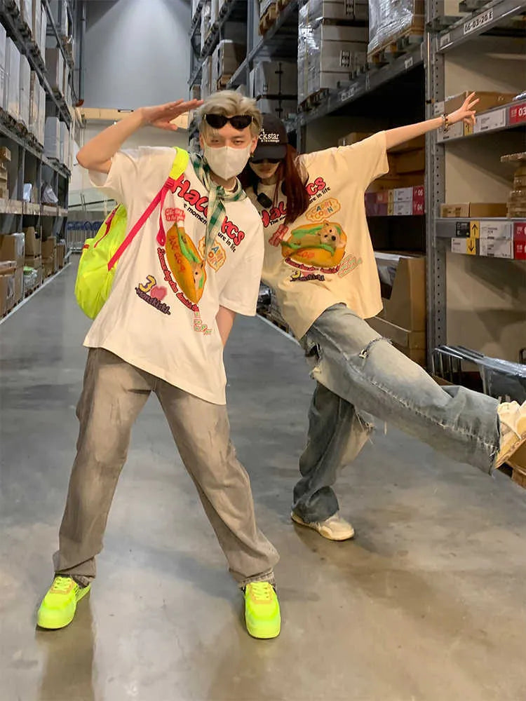 Cartoon hamburger dog printed short-sleeved cotton t-shirt in loose fit, shown in apricot colour.