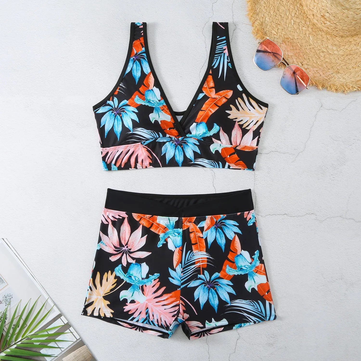 Women's two-piece printed boxer style bikini set in a multi-colour design on polyester fabric.