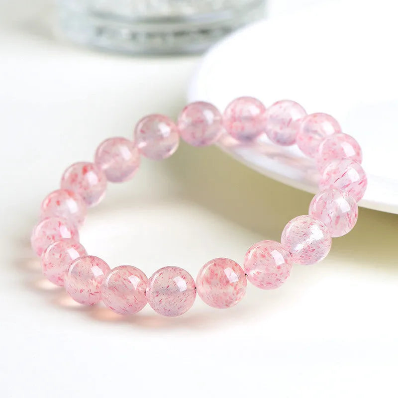 Natural strawberry quartz crystal bracelet with geometric sphere beads measuring 10-10.8mm