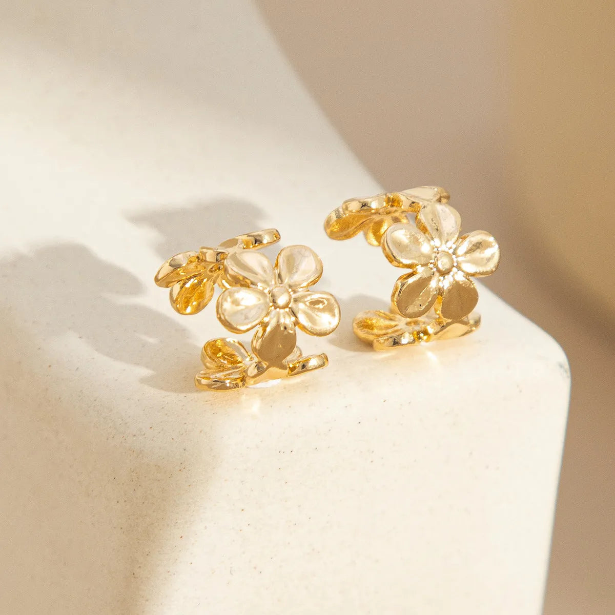 Gold starfish and scallop eardrop earrings with electroplated finish and conch details