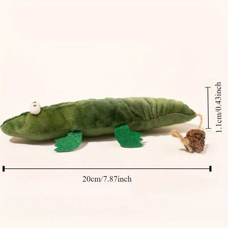 Green plush alligator cat toy with catnip filling and peppermint scent for oral cleansing.
