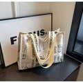 Large canvas tote bag with printed design options including letters and patterns.