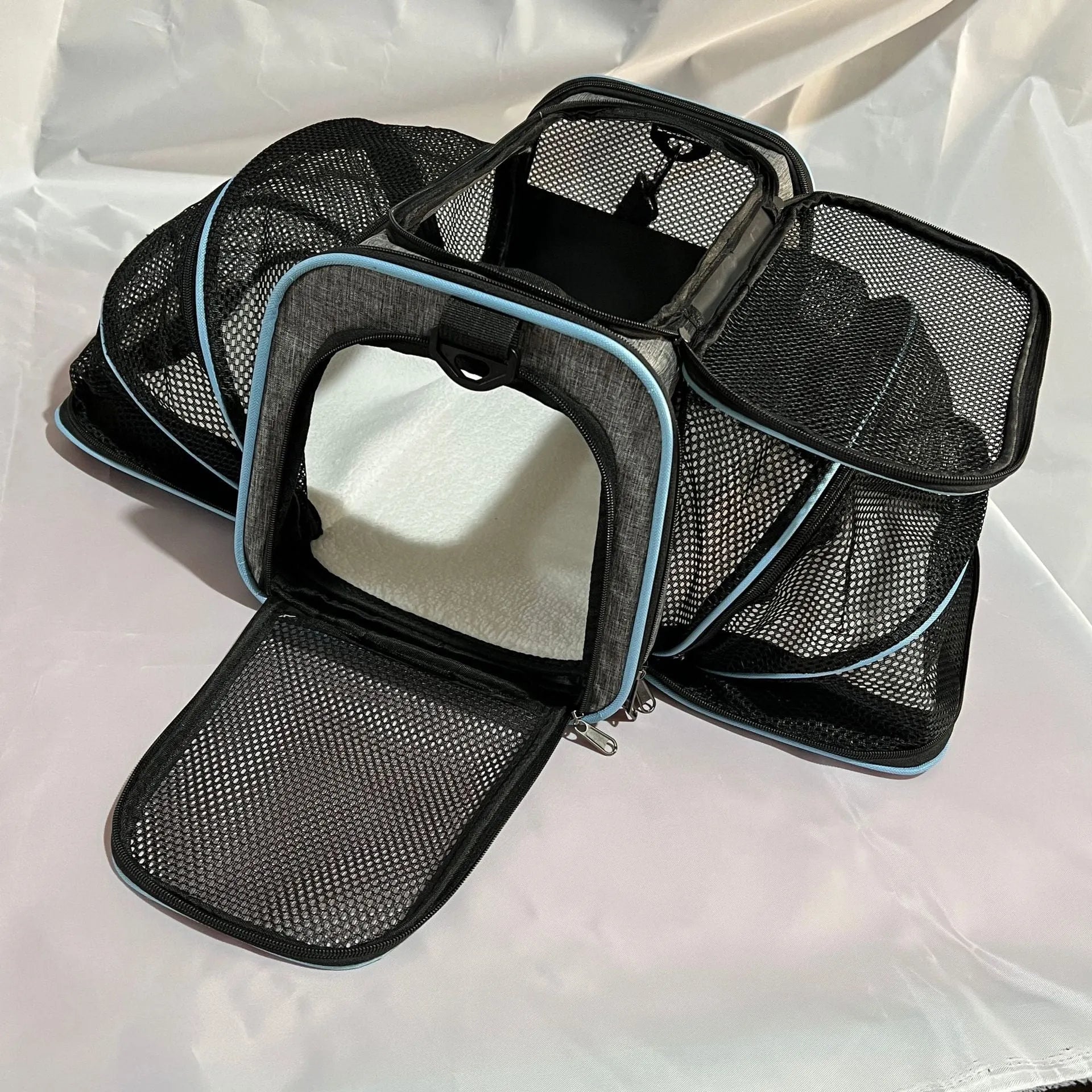 Large and small size cat carrier bag made from 600D cation fabric in black, grey blue, and grey green colour options