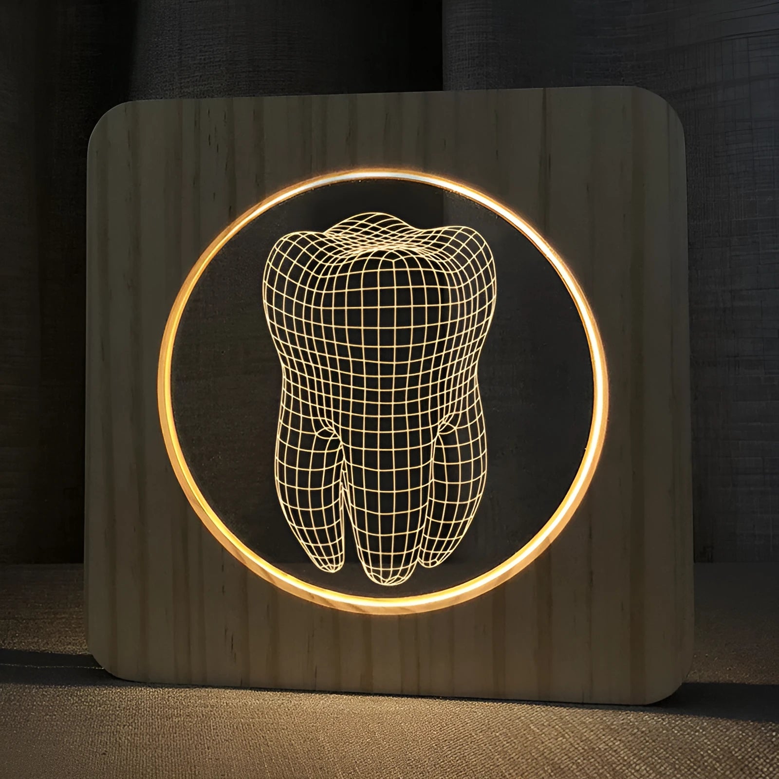Square tooth-shaped wood colour acrylic night lamp with USB cable on a desk.