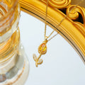 Gold electroplated tulip flower necklace with zircon stones on titanium steel chain