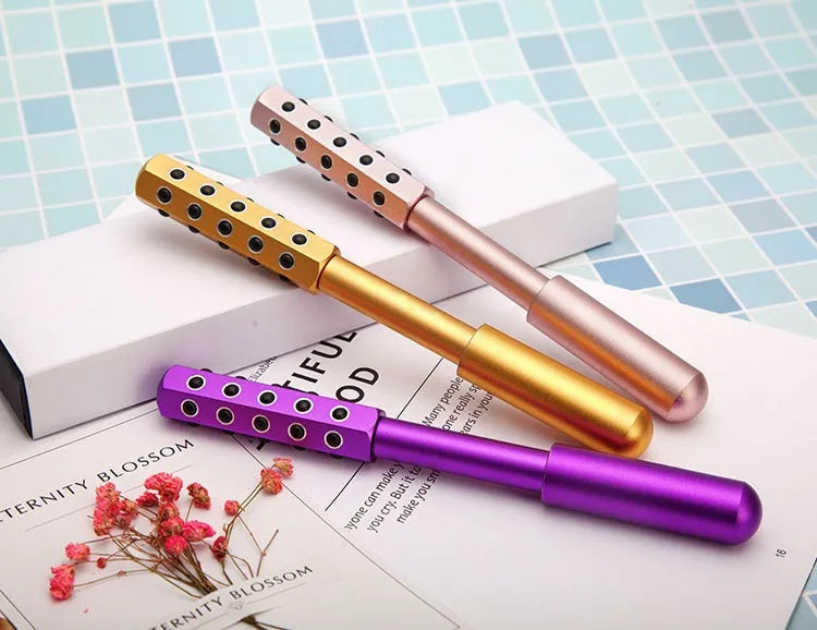 Germanium particles purple facial roller massage instrument, approximately 193mm long.