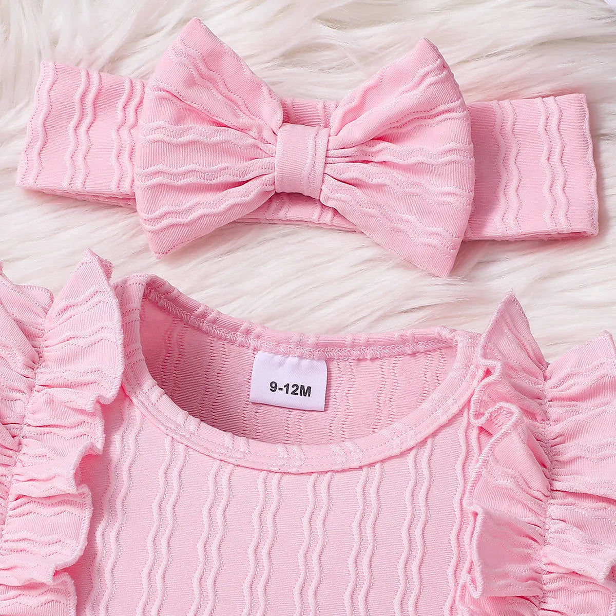 Pink baby girl three-piece set with ribbed frill long sleeve romper, pants, and matching headscarf on white background