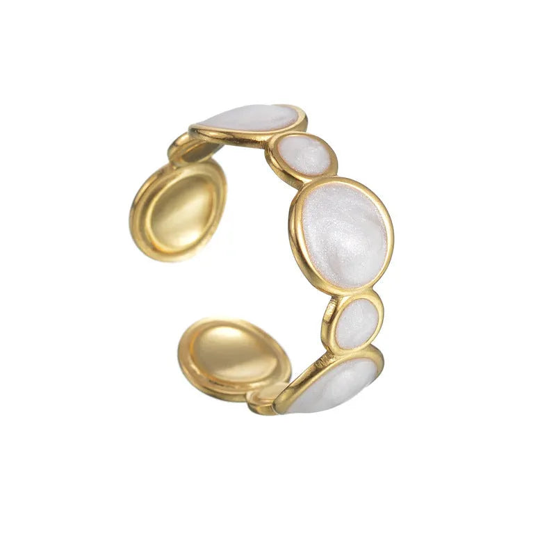 A geometric-shaped stainless steel ring with an adjustable opening on a plain background.