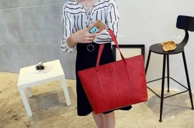 Simple fashion shoulder bag with crossbody strap in black or grey colour for spring and summer