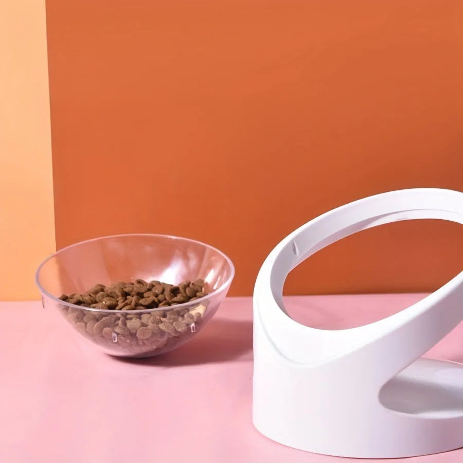 White elevated tilted plastic cat food bowl for ergonomic feeding.