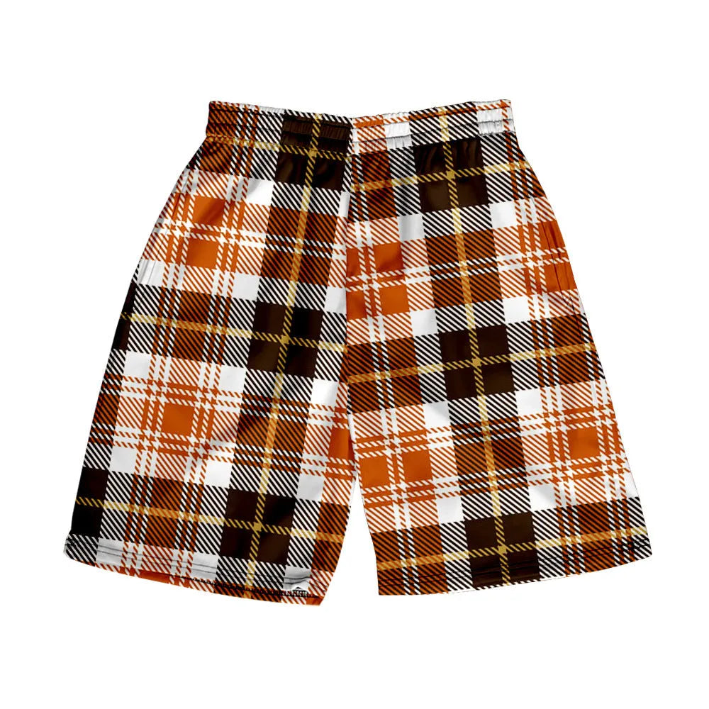 Man wearing straight-fit plaid casual shorts with an elastic waistband.