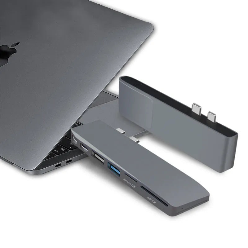 Silver 8-in-1 USB-C hub for MacBook Pro with dual connectors and multiple ports