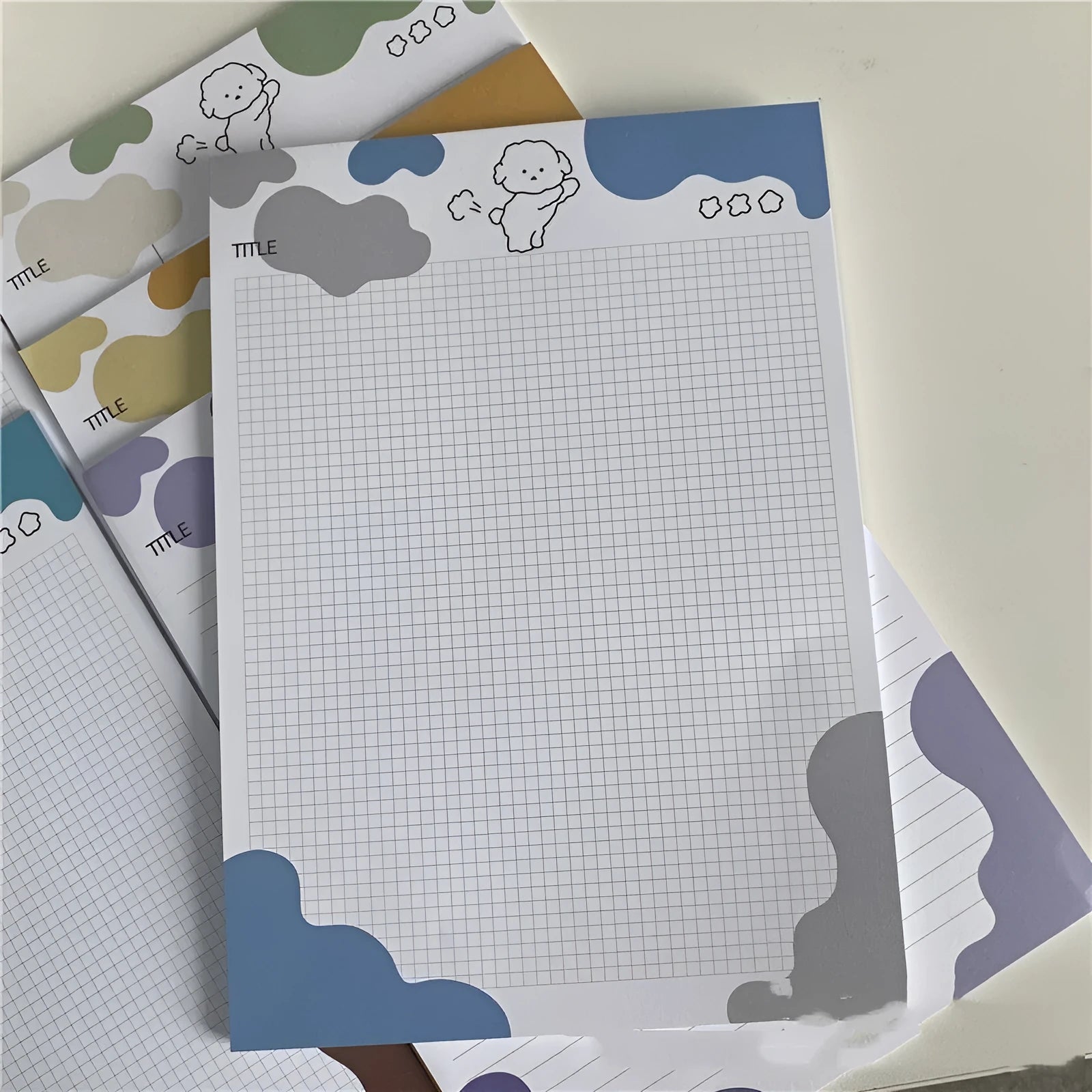 B5 sticky note pad with dog illustration cover, showing one sheet peeled back to reveal adhesive.
