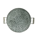 Round wrought iron storage tray in two sizes on a wooden surface