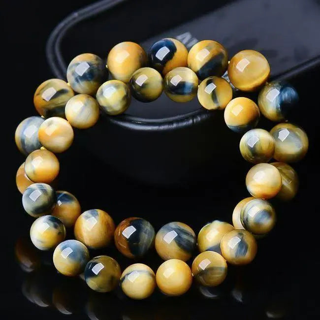 Fantasy Tiger Eye agate bracelet with round beads in a single circle design on a wrist.