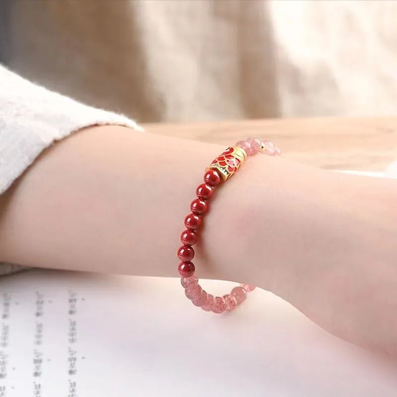 Purple cinnabar bracelet with strawberry quartz beads and peach blossom charm