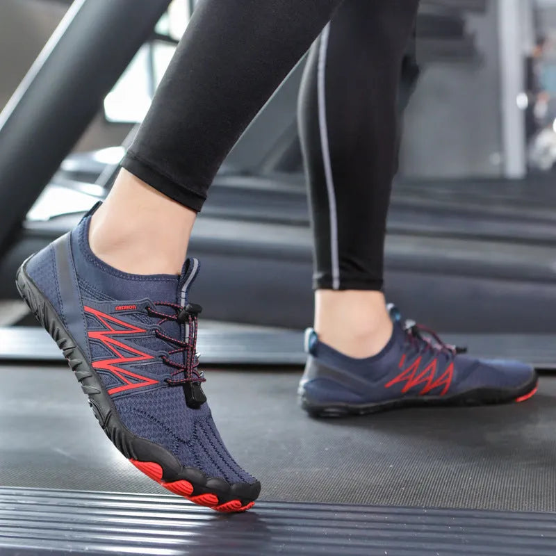 Indoor fitness training shoes in striped design with low-top profile and rubber sole.