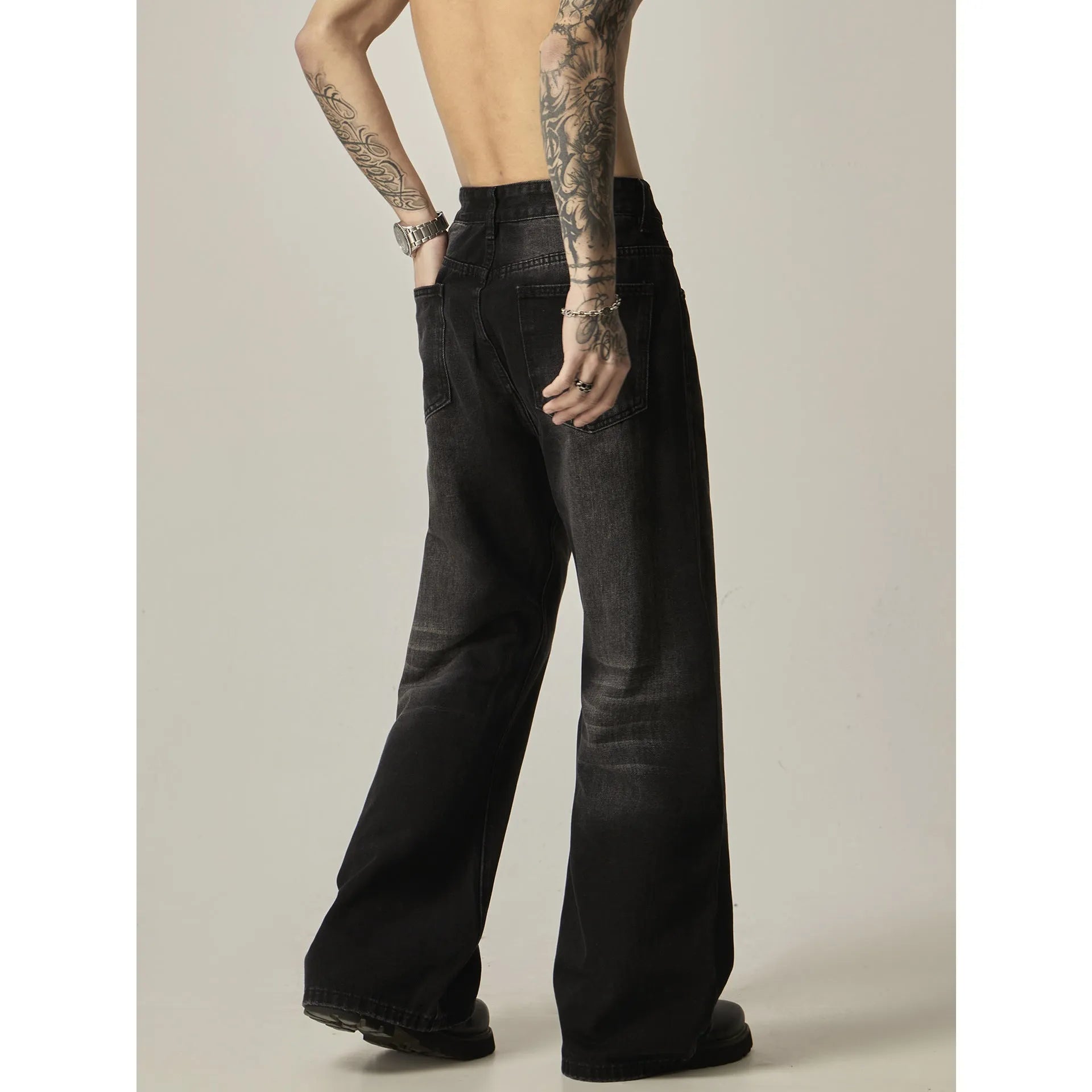 Black loose straight leg jeans with zipper fly and retro styling