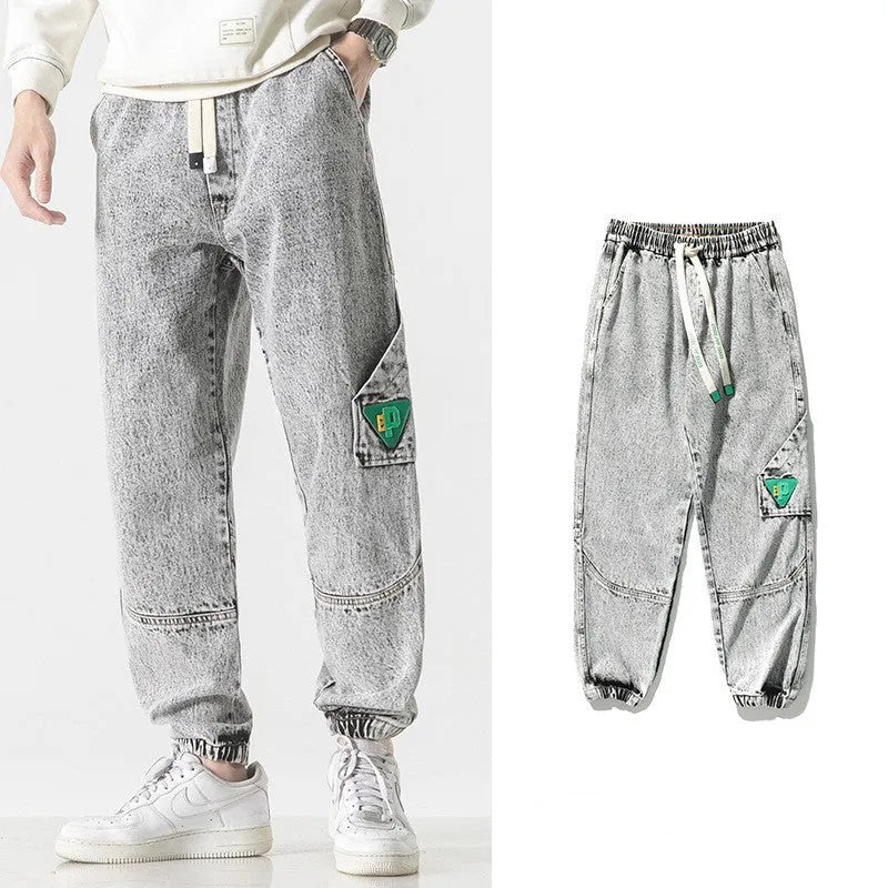 Men's loose-fit tapered cotton trousers in black, blue, and grey colours with mid-waist design