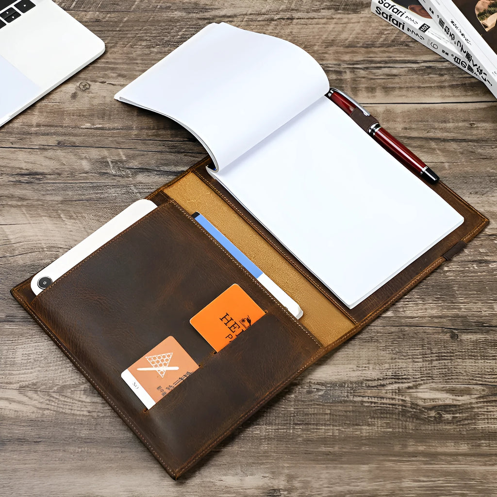 Brown Crazy Horse leather protective sleeve for A5 notebooks with a socket-type closure.