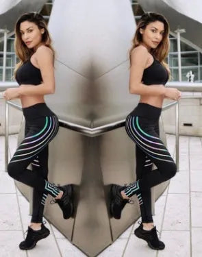 Women's reflective workout leggings with glow print in black and white colours showing slim-fit pencil pants design