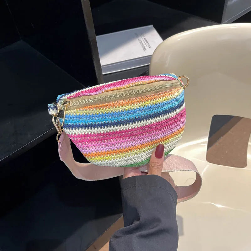 Bohemian woven straw beach bag with single strap in pink or blue showing sandwich pocket and shell shape