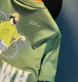 Green men's loose-fit T-shirt with a printed Literary Youth graphic on the front.