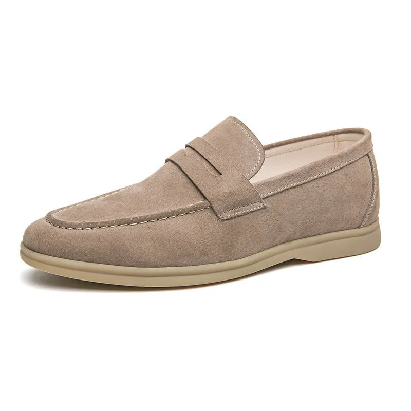 Men's black leather slip-on shoes with round toe and oversleeve design on a rubber sole
