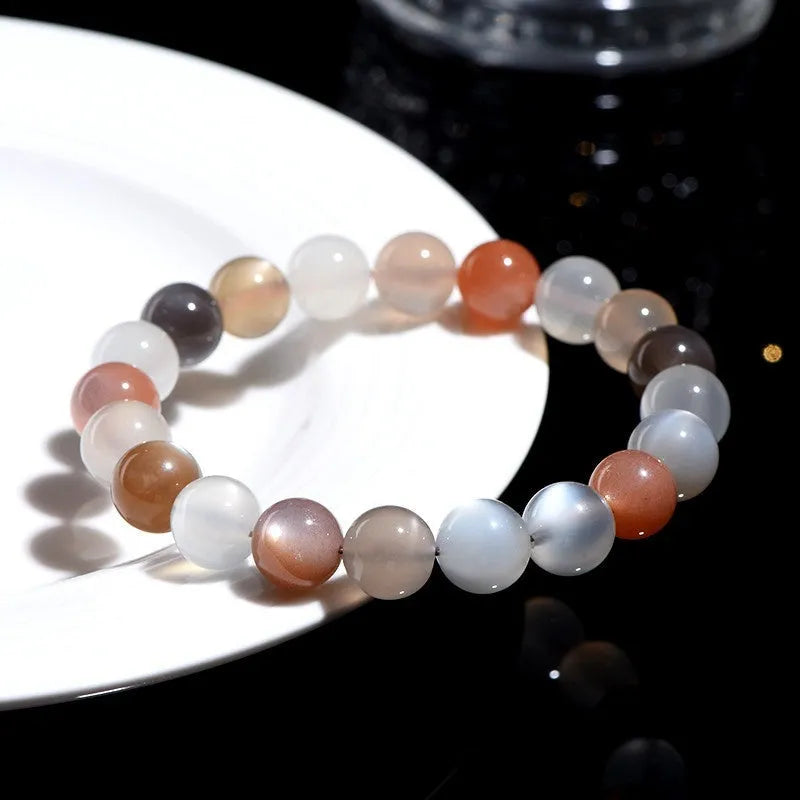 Natural moonstone bracelet with colourful pattern showing 8mm beads in single circle configuration