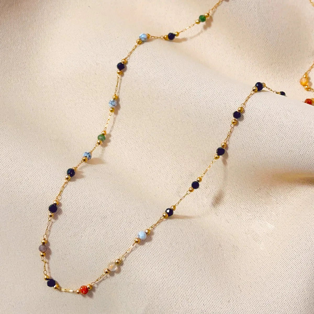 Gold electroplated titanium steel necklace with natural stone pendant on O-ring chain for women