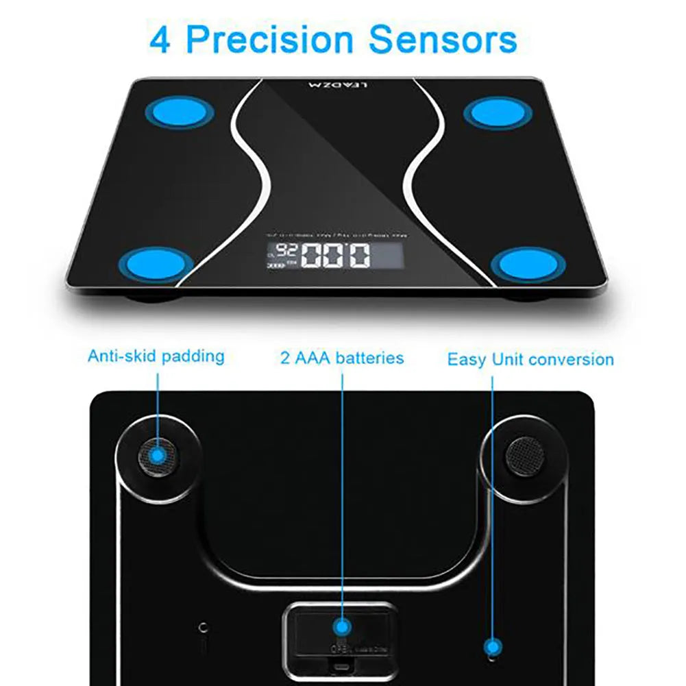 Black electronic bathroom scale with digital display on tempered glass platform